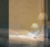 Blonde in puppy shirt and colorful skirt lays back on bed while using