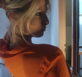 Blonde in orange shirt and white panties pauses to get a good look in