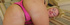 Blonde in pink lingerie has her holes played with on the sofa.