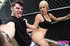 Blonde college coed in a black tank gives her guy the goods in public.
