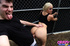 Blonde college coed in a black tank gives her guy the goods in public.