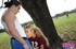 Coed in a numbered jersey takes off jeans to fuck in the park by a large