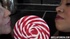 Chicks in holiday clothes lick a lollipop and start making out.