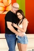 Young brunette enthusiastically sucks and rides an old man's dick on white