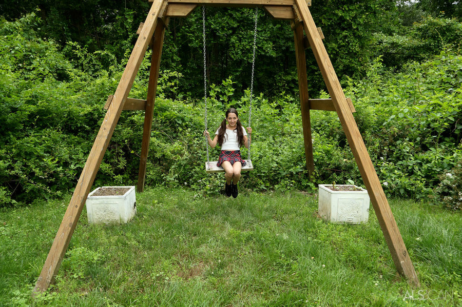 Petite girl plays on the swing outside with a glass dildo stuck in her pussy - XXXonXXX - Pic 1