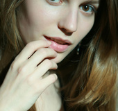 Young girl with a slim body gets glitter all over her body before masturbating