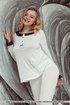 Fascinating blonde wearing white button up pajamas showing off her gorgeous