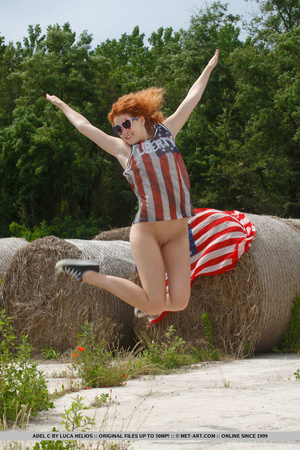 Red head slut brings the american flag and fucks herself outdoors beside a big rock - XXXonXXX - Pic 7