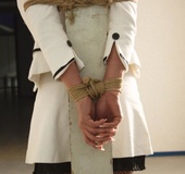 Chic cute blonde in hot white outfit and black lingerie tied and ball