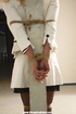 Chic cute blonde in hot white outfit and black lingerie tied and ball