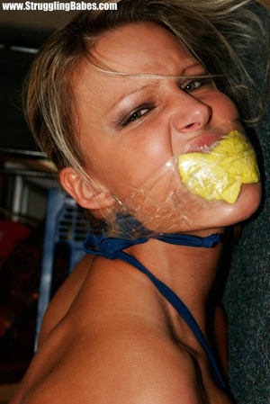 Spicy brunette in short dress hog tied, mouth stuffed and taped with tits squeezed - XXXonXXX - Pic 12