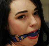 Dark hair beauty in pink corset and boots tied, gagged and transported