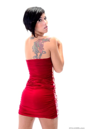 Brunette in tiny dress shows off leather panties and tattoos - Picture 13
