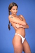 Slim gal with braids in her hair wears white panties while shedding a