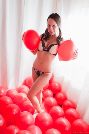Foxy hotties pose their alluring bodies in black and white underwear and in black lingerie before they get naked and expose their indulging tits and lusty pussies in different poses in a white room full of red balloons. - Picture 9