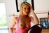 Bewitching blonde in pink peeks out her perky tits and pulls on her super
