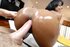 Mocha skinned beauty with natural large tits gets her oiled ass fucked