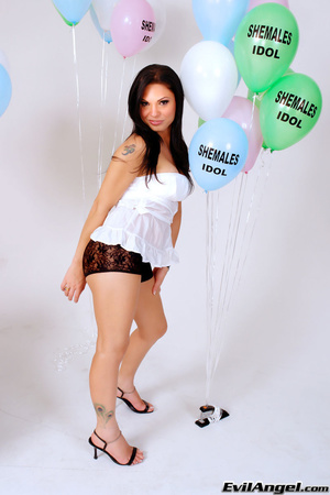 Innocent tattooed ladyboy in white top and shorts play with balloons while showing her curves - XXXonXXX - Pic 10