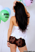 Innocent tattooed ladyboy in white top and shorts play with balloons while