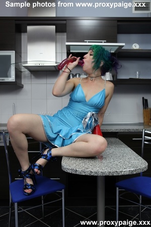 Punk teen with green hair and piercing in blue dress toying her asshole in the kitchen - Picture 3