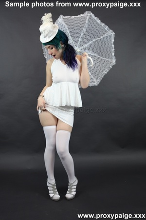 Teen cutie in white suit, hat, stockings and umbrella playing with her asshole prolapse - Picture 14