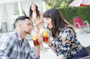 Couple enjoys a refreshing drink outdoor - Picture 4