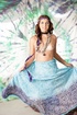 Cute hippie girl strips off her clothes and exposes her beautiful body