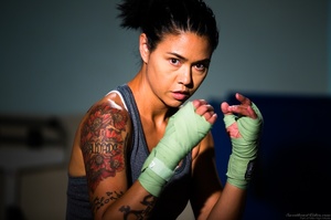 Exotic tattooed fighter in ponytail posi - Picture 1