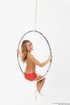 Sporty blonde posing naked on this circle-thing