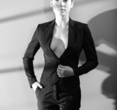 Short-haired brunette takes off her manly clothes in B/W