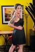 Mature brunette wiggles out of black dress and posing in pink bra and