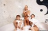 Teasing three girls wearing dainty earrings touch and suck on their tits