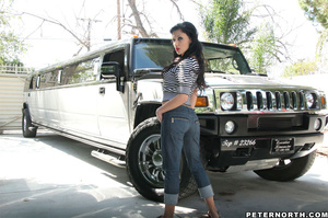 Gorgeous brunette teases with her curves fully clothed near a large SUV - Picture 10