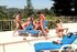 Three young harlots took off their bikinis and enjoy hardcore orgy outdoors