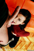 Black haired babe in red top and black pants enjoys pussy fucking and