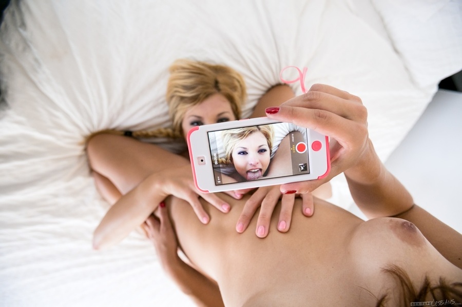 Steaming hot brunette and a blonde hottie show their lusty boobs while they make out naked before they lick each others cracks in different positions on a white bed. - XXXonXXX - Pic 10