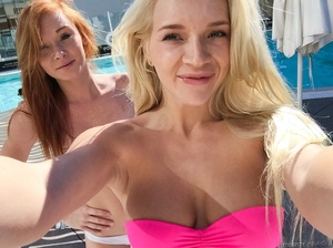 Alluring hotties in pink and white bikini display the foxy bodies by the pool before they get naked and reveals their sweet boobs while they lick each others twats. - Picture 8