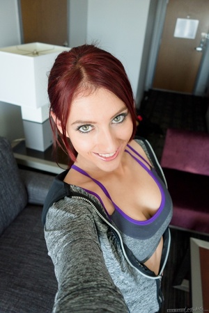 Foxy redhead wearing gray jacket, leggings, gym bra, pink and black polka dotted panty and black rubber shoes and in purple shirt, jeans shorts, gray socks and black boots display their alluring bodies then gets naked and expose their sweet boobs and juicy pussy in different poses on a gray couch. - Picture 2
