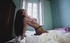 Brunette fills slit with dildo through fishnet stockings