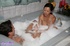 Asian chick takes off her pink robe then teases a handsome dude with her
