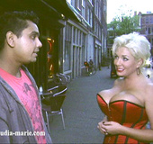 Corset-wearing blonde fucked from behind up the asshole