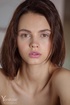 hazel-eyed brunette takes off