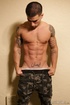 Hot guy in a camo pants gets naked to show his amazing package