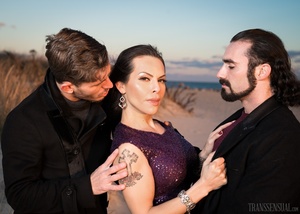 Lucky shemale in a purple dress caught in between two handsome men - Picture 14