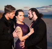 Lucky shemale in a purple dress caught in between two handsome men