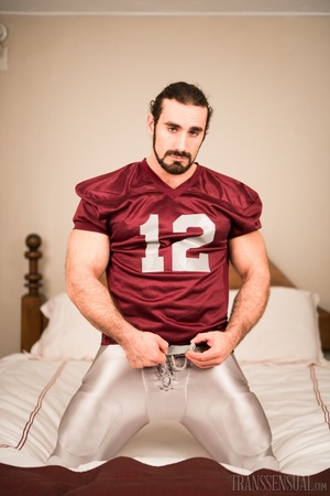 Buff football guy poses with his shemale lover showing their wangs - XXXonXXX - Pic 1