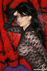Brunette with big tits likes to show her curves in a see-thru top.