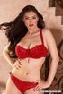 Woman in red lingerie loves to show off her big tits.
