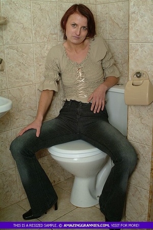 Mature hottie takes off her brown blouse, jeans and black high heels then expose her sweet boobs and skinny body before she pulls her white panty aside and expose her hairy crack in the bathroom. - XXXonXXX - Pic 1