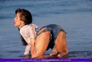 Smoking hot MILF gets her steaming hot body wet at the beach wearing white blouse and jeans shorts. - XXXonXXX - Pic 1
